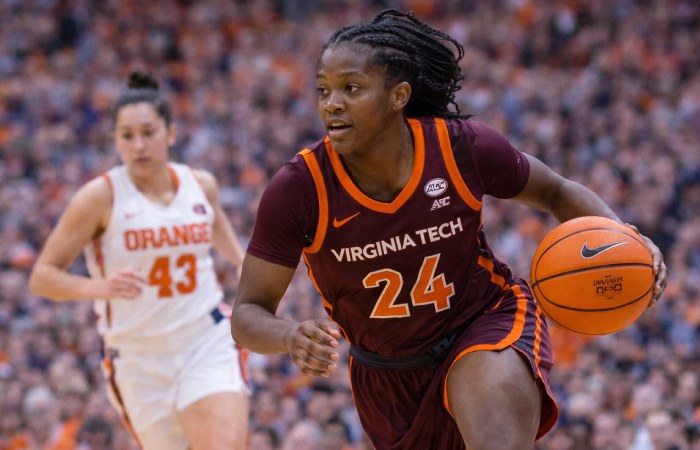 Virginia Tech forward Carys Baker securing a rebound in a competitive matchup