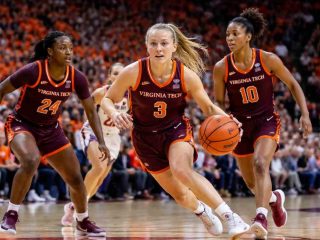 Virginia Tech Hokies women’s basketball players in an intense game moment on court