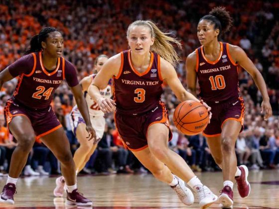 Virginia Tech Hokies women’s basketball players in an intense game moment on court