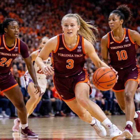 Virginia Tech Hokies women’s basketball players in an intense game moment on court